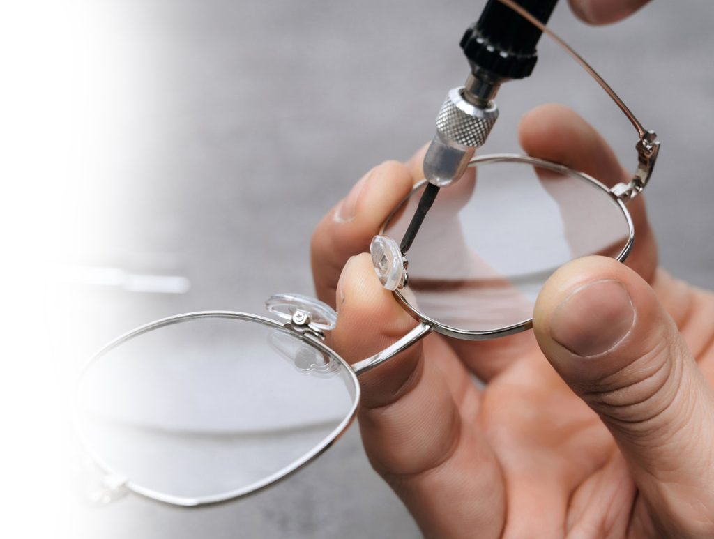 Eyewear repair man fixing pads